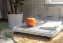 Apple Health scale - photo of an apple sitting on a floor scale in a bathroom